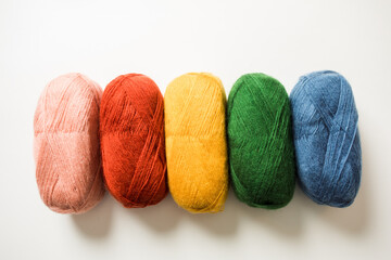 Collection of threads of rainbow color on the white background