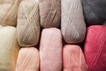 Closeup of skeins of multicolored threads as a background
