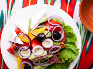  Vegetable slicing in Georgian style - tomatoes, cucumbers, greens, Bulgarian pepper, cheese, onion. Asian style