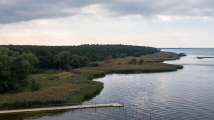 Trzebiez, Poland. Aerial view on coast of Zalew Szczecinski and forest. Drone photo 