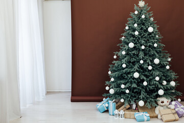 Christmas tree with gift decoration decor balls garlands new year interior