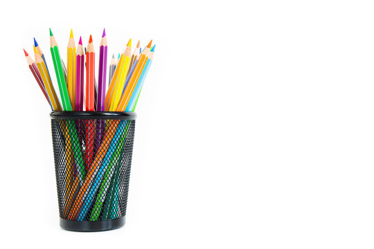 Bunch of colored pencils in a pencil holder. Macro still-file picture taken in studio with white background and softbox.