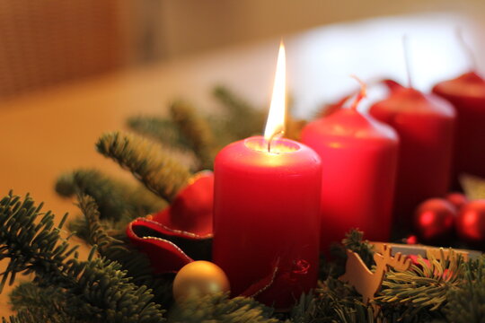 A burning candle on the first of Advent.