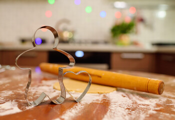 form for baking gingerbread in the shape of a man and in the shape of a heart on the background of...