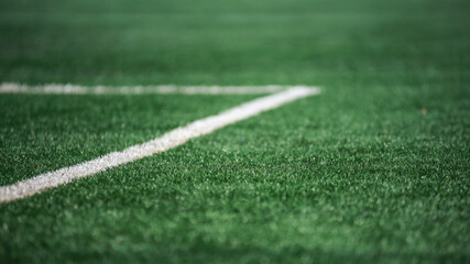 Football field green grass and white lines
