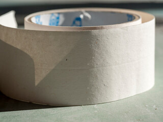 close - up of perforated paper tape for sealing seams in drywall. selective focus