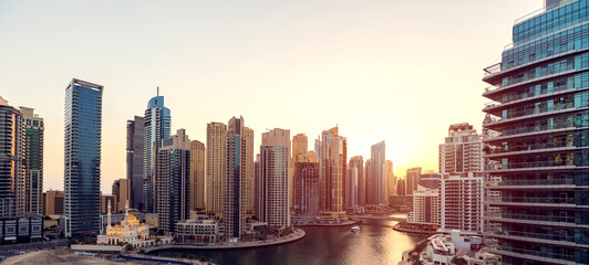 Fototapeta premium Cityscape and skyscraper at sunset in Dubai Marina.