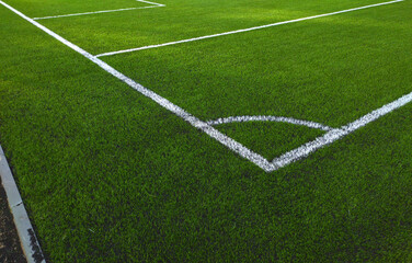 Artificial grass soccer field. Corner kick line of ball and a soccer field , football field , background texture
