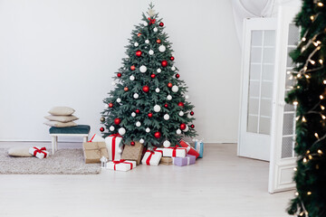 Christmas tree with gift decoration balls garlands new year interior