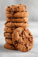 Freshly baked homemade crunchy cookies with chocolate chips, peanut butter or salted caramel. A delicious treat for gourmets. Biscuits close-up. Selective focus, shallow depth of field