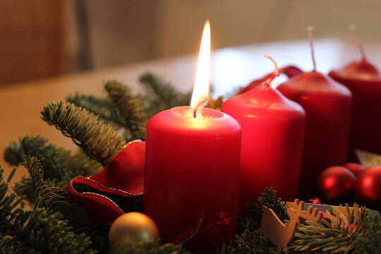 A burning candle on the first of Advent.