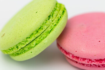 Macaroons isolated on the white background.Homemade french style colorful macaroons. Green, white, pink cookies.