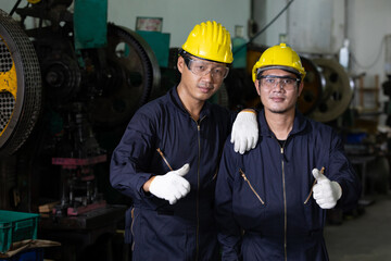 portrait successful post two male engineer worker or mechanic in factory