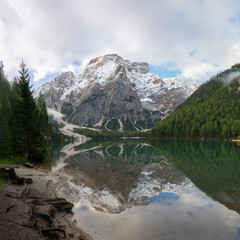 Square view of Mount Seekofel mirroring in the clear calm water of iconic mountain lake Pragser Wildsee (Lago di Braies) in Italy, Dolomites, Unesco World Heritage, South Tyrol