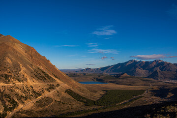 Winding road heading to La Hoya ski center during sunset in Esquel, Patagonia, Argentina	