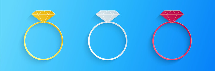 Paper cut Diamond engagement ring icon isolated on blue background. Paper art style. Vector.
