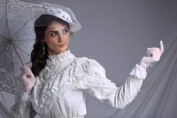 Portrait of a beautiful girl in a white dress of the nineteenth century