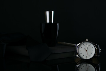wrist watch with a notebook and a pen.Business man accessories.