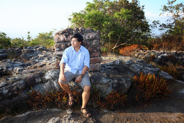 man sitting on stone