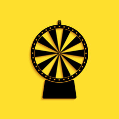 Black Lucky wheel icon isolated on yellow background. Long shadow style. Vector.