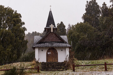 Fototapeta na wymiar Virgen del Lago chapel at Los Alerces National Park during winter season in Esquel, Patagonia, Argentina