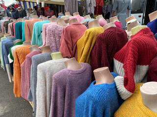 Women's clothing of different colors on headless mannequins