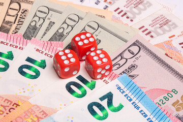 American dollars, euros, rubles, and dice on top. Gambling.