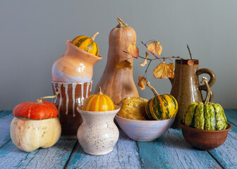 Obraz na płótnie Canvas Still life with decorative pumpkins and pottery.