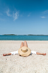 Fototapeta na wymiar woman sunbathing at sea beach. summer vacation