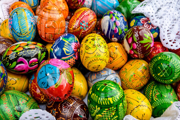 Fototapeta na wymiar Easter celebration background with easter eggs and flower.