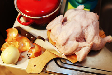 Chicken carcass on a cutting board. Cooking poultry meat according to traditional recipes. Close-up