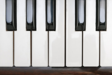 Naklejka premium Classical piano keyboard, black and white keys of musical instrument close up, top view