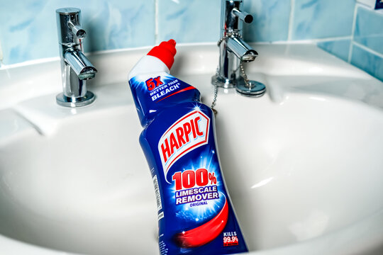 Norwich, Norfolk, UK – November 28 2020. An illustrative editorial photo of a bottle of Harpic 100% limescale remover in a bathroom sink