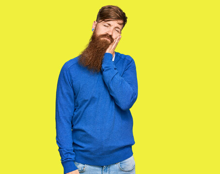 Young irish redhead man wearing casual clothes thinking looking tired and bored with depression problems with crossed arms.