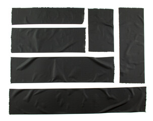 Set of torn and crumpled pieces of black adhesive tape on white background. Creased different size black sticky tape.