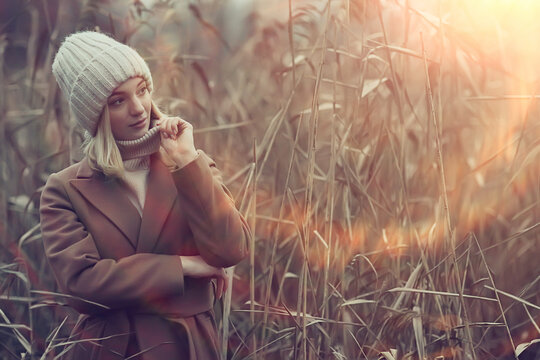 autumn fashionable portrait romantic girl in grass, travel seasonal look