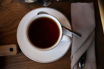 a Cup of black tea in a white Cup