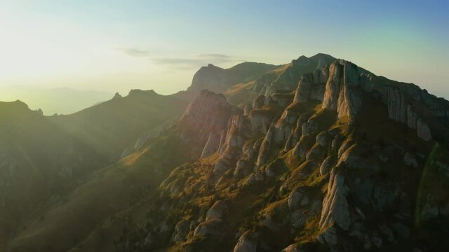 Drone view over Ciucas Peak at sunset, beautiful mountain scenery in Romania