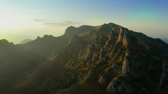 Drone view over Ciucas Peak at sunset, beautiful mountain scenery in Romania