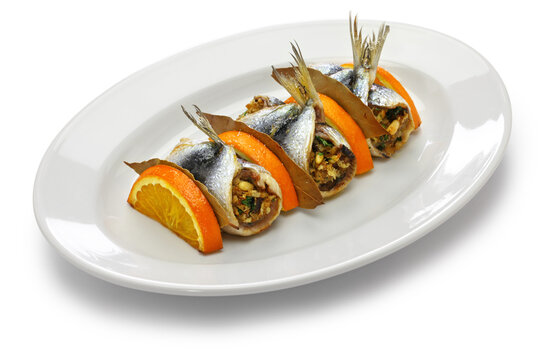 Sarde a Beccafico, traditional Sicilian cuisine, anchovy roolls stuffed bread crumbs, raisins and pine nuts.
