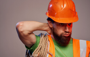 Male builder in orange hard hat work fatigue industry