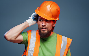 Male worker in orange paint emotions construction studio