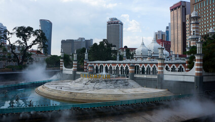 Obraz premium View on Jamek Mosque and River of Life, Kuala Lumpur, Malaysia 