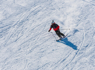 A skier descends from the mountain at high speed at a ski resort GrandVallira. Pyrenees, Andorra