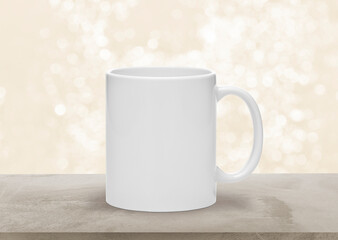 Obraz premium Mockup empty white ceramic coffee or tea cup, mug on beige clean stone table, with space for text, product display banner