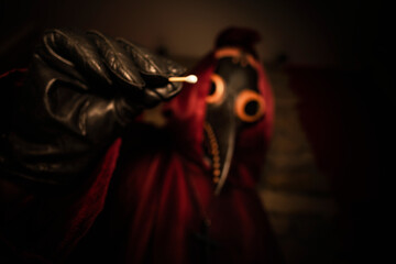 a doctor in a plague mask takes a test for coronavirus