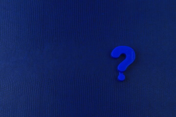 Question mark from childrens toy alphabet and copy space for caption