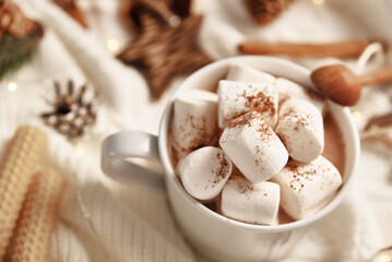 Cup of hot chocolate with marshmallow and christmas decorations. Winter cozy home concept