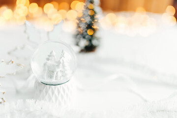 white christmas decoration on a table, white snowball and decorations