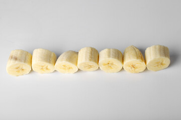 Obraz na płótnie Canvas Sliced banana slices on a white background close-up